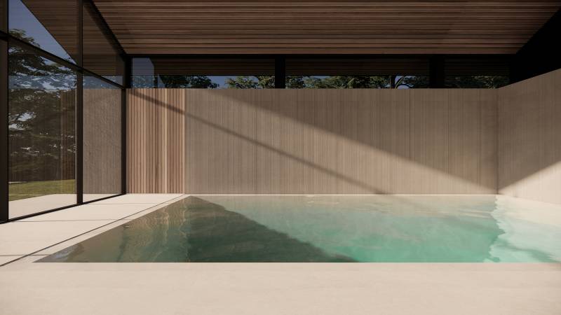 piscine d'intérieur avec murs de pierre